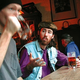 The guy (right) discusses Stevie Ray Vaughan with an uninterested stranger.